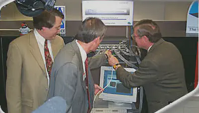 NCSA Director Larry Smarr (left), UNM President William Gordon, and U.S. Sen. Pete Domenici turn on the Roadrunner supercomputer in April 1999. After the ceremony, Sen. Domenici asked if this new capability could be shared with his friend Senator Ted Stevens in Alaska. I packaged the machine for shipping to its new home, the Arctic Region Supercomputing Center affiliated with the University of Alaska, Fairbanks. (Image credit: Reprinted with permission of NCSA.)