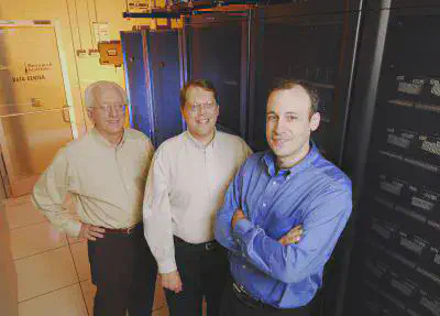 Researchers Mark Richards, David Bader and Dan Campbell (left to right) pose in the Advanced Computing Technology Lab operated by the Georgia Tech Research Institute. *Image Credit: Gary Meek*