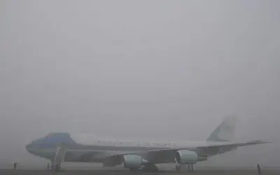 Air Force One waits for U.S. President Barack Obama in the fog at London's Stansted Airport, Friday, April 3, 2009. PHOTO: AP / KIRSTY WIGGLESWORTH
