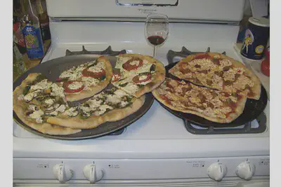 Google’s trained computers recognized that this is a photo of “two pizzas sitting on top of a stove top oven” *Google*
