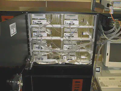 Inside a Roadrunner cabinet with each node attached to three networks: Myrinet (ribbon cable), Fast Ethernet (CAT5), and Diagnostic (RS232 serial port). (Image credit: Courtesy of the author.)