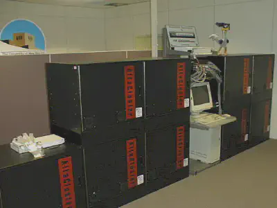 Linux prototype on lower-left, and Roadrunner (right). A Myricom dual 8-port SAN Myrinet switch sits on top of the left-most cabinet of the prototype, and four octal 8-port SAN Myrinet switches (not visible) connect Roadrunner. Above Roadrunner’s console is a 72-port Foundry Fast Ethernet switch with Gigabit uplinks to the vBNS and Internet. (Image credit: Courtesy of the author.)