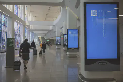 Screens show a blue error message at a departure floor of LaGuardia Airport in New York on Friday, July 19, 2024, after a faulty CrowdStrike update caused a major internet outage for computers running Microsoft Windows. (AP Photo/Yuki Iwamura) (ASSOCIATED PRESS)