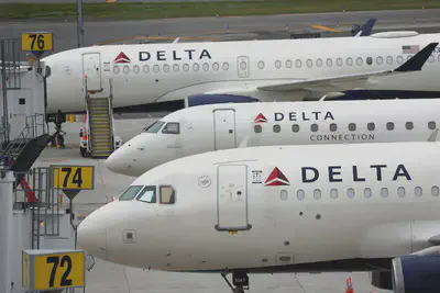 Delta Airlines passenger jets are pictured outside Terminal C at LaGuardia Airport in New York, June 1, 2022. Mike Segar/Reuters, FILE