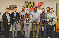 l to r: ECE Chair Sennur Ulukus, Professor Kaiqing Zhang, Chris Boyle, Emma Griffith, Faisal Hamman, Zachary Lazri, Pasan Dissanayake, Subhankar Banerjee, Sydney Overton