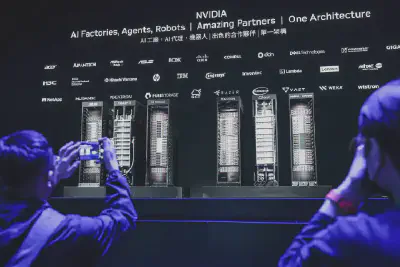 Participants take pictures of Nvidia's GPUs in Taipei on May 19, 2025. *(I-Hwa Cheng/AFP/Getty Images)*