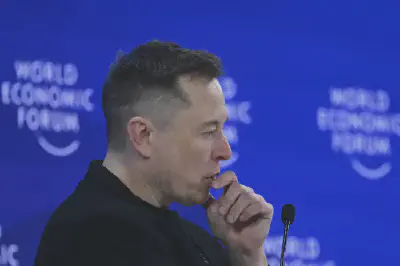 Elon Musk delivers a speech during the 2026 World Economic Forum Annual Meeting in Davos, Switzerland. (*Harun Ozalp/Anadolu/Getty Images*)