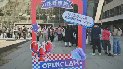 People queue to have their laptops install with OpenClaw, an open-source AI assistant at the Baidu headquarter in Beijing on March 11, 2026. *Adek Berry | Afp | Getty Images*